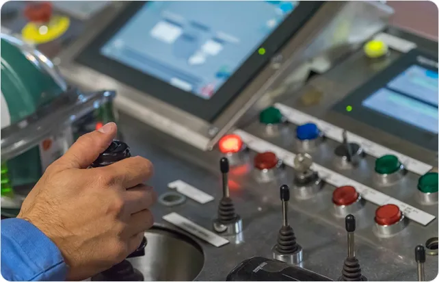 Industrial machinery control panel with digital displays and buttons